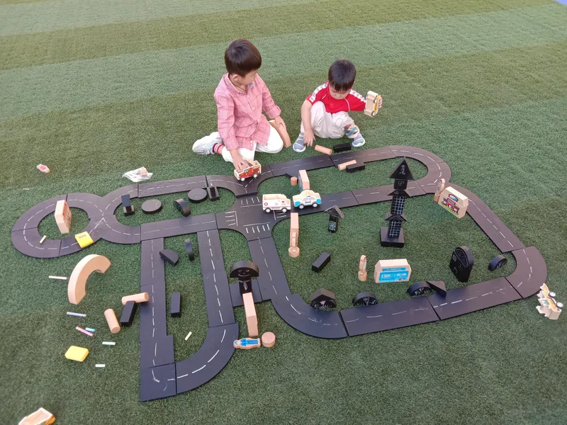 Young engineers building with chalkboard blocks - STEM engineering learning