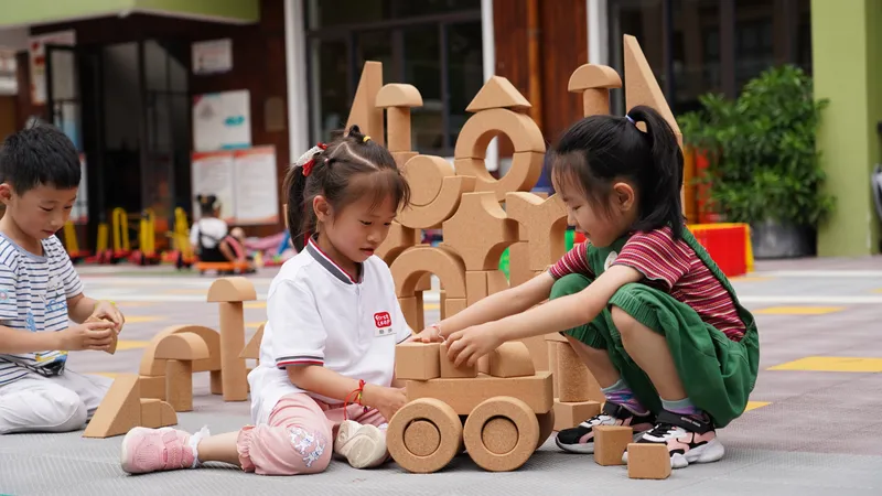 Preschool children engaging in associative play with wooden blocks