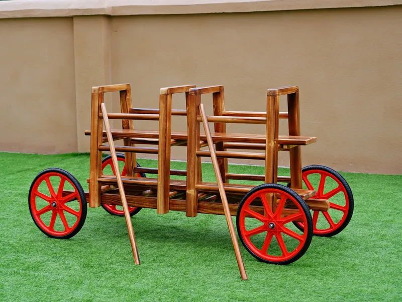 Children playing on charred wood train adventure set