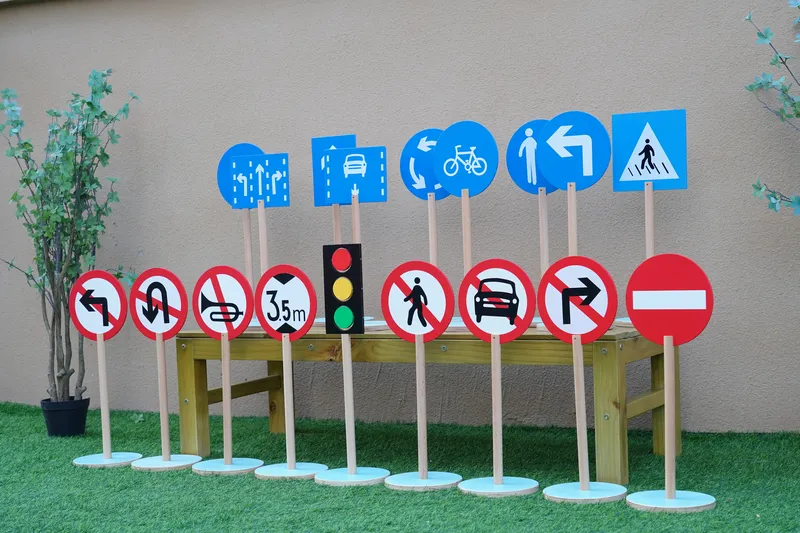 Traffic signs with directional indicators and safety symbols