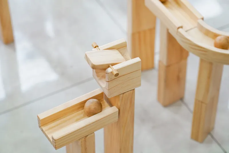 Marble run track components and connecting pins