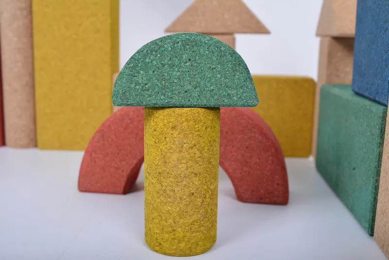 Sustainable cork material construction with transparent base paint and beveled edges