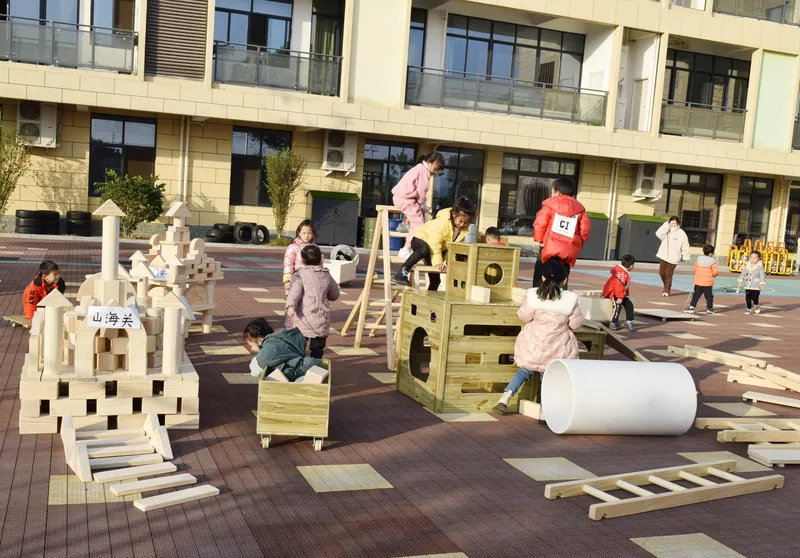 Complete set of anji play materials including wooden blocks, ladders, barrels, climbing cubes and mats for kindergarten