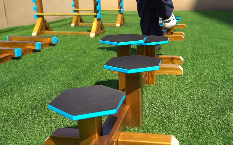 kids obstacle course equipment for preschools with children developing motor skills