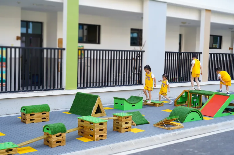 Children using parkour equipment for athletic skill development