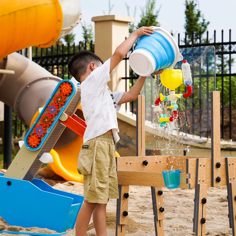 Children using water drawing table