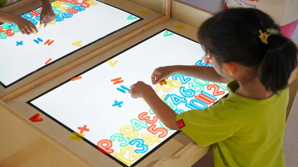 Pre K Activities close-up of children using tactile learning toys for sensory development