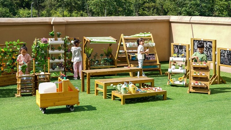 Play Village with children learning through wooden educational play structures