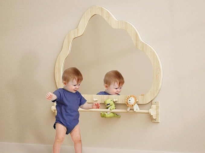 Montessori Mirror: Essential Guide for Early Education Centers 4 The child plays happily in front of the montessori mirror.