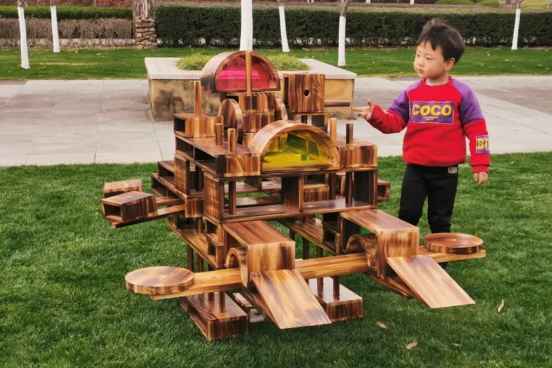 Safe construction toys for preschoolers aged 2-3 featuring large wooden blocks