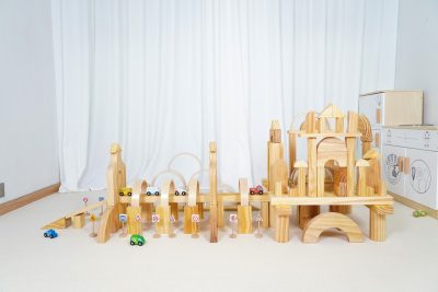 136-piece traffic town wooden building block set arranged as bridges, towers and roads with signs and vehicles
