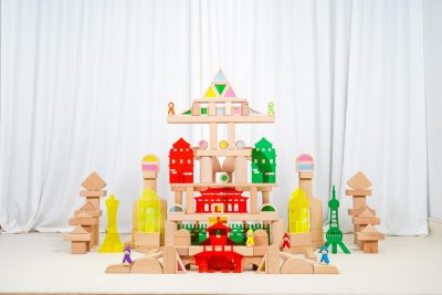 Colorful cityscape built with wooden blocks acrylic landmark pieces and six elf figures