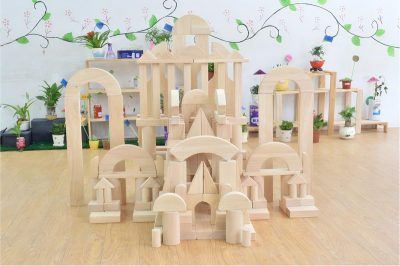 Large architectural construction built with 200-piece jumbo solid beechwood unit blocks