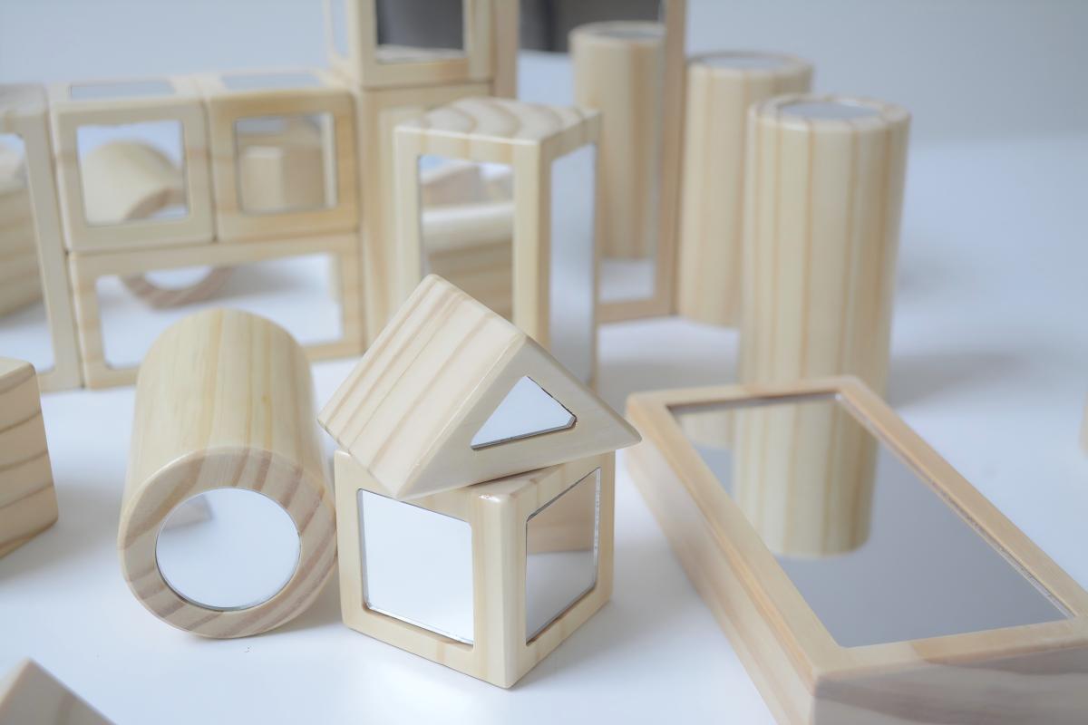 Reflective-panel wooden blocks for open-ended construction and visual exploration