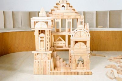 518-piece expanded preschool architectural and railway wooden building blocks arranged as a large city construction