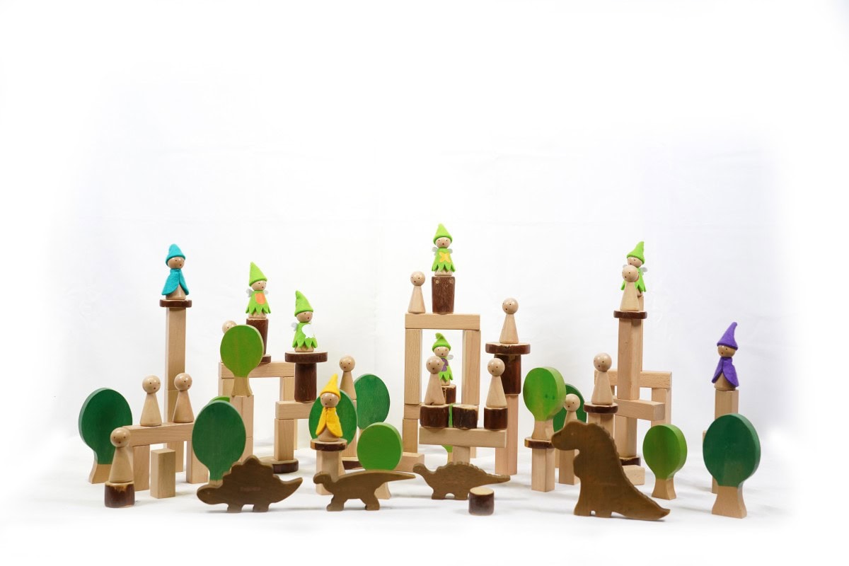 Construction Toys for Preschoolers: 9 Powerful Buying Tips 2 Child arranging a wooden rainbow construction and balancing toy