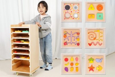 Mobile Montessori learning cabinet with six removable sensory, maze and wooden puzzle activity boards