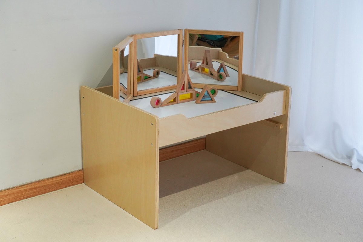 Sensory Light Table Guide: 15 Activities and Setup Tips 5 Wooden sensory light table installed in a preschool classroom