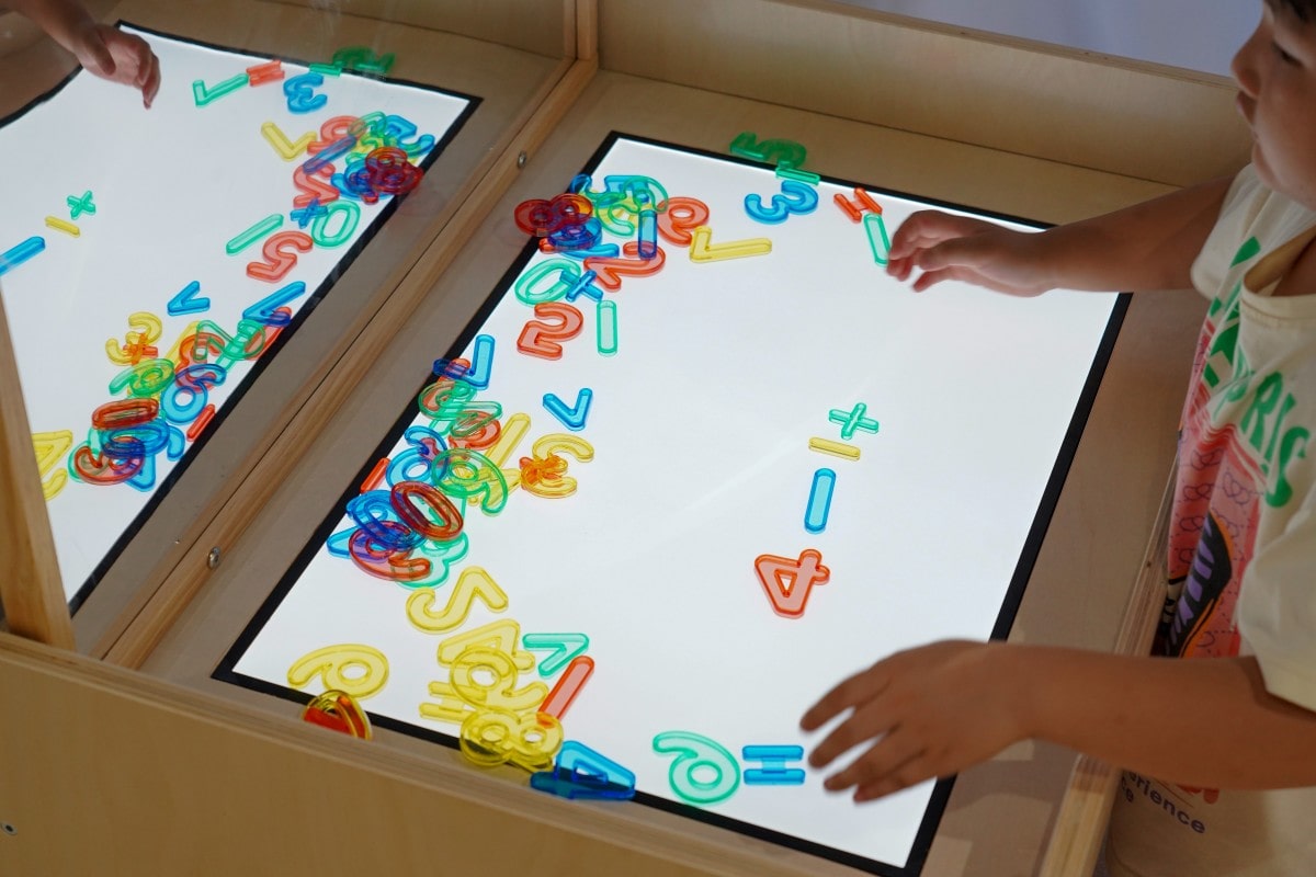 Sensory Light Table Guide: 15 Activities and Setup Tips 6 Sensory light table learning area in an early childhood classroom
