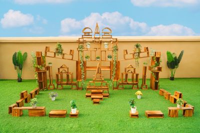 128-piece outdoor hollow wooden building blocks arranged into large architectural structures