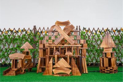 330-piece outdoor wooden building block set assembled into large carbonized architectural structures