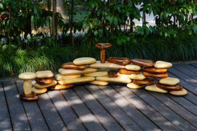 34-piece outdoor pebble building blocks in natural and carbonized New Zealand pine