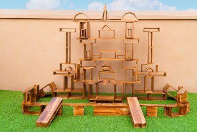 80-piece outdoor hollow wooden blocks arranged into a large architectural construction with frames and long boards
