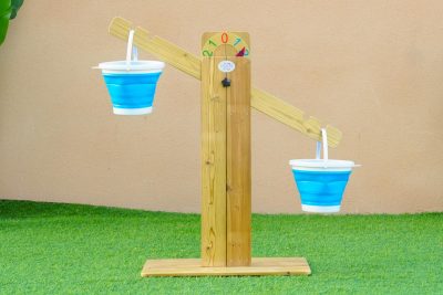 outdoor wooden sand balance scale with two hanging buckets for preschool STEM play