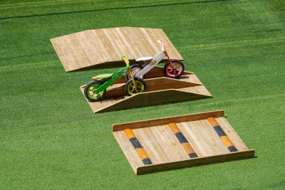 balance bike obstacle course with wooden incline ramp speed bump platform and seesaw obstacle