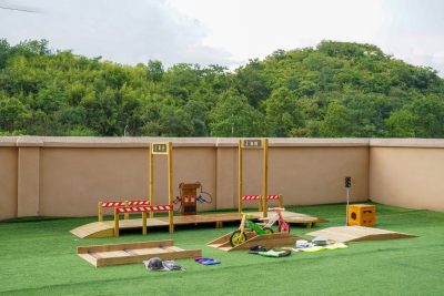 preschool balance bike track with wooden road platforms traffic checkpoints riding obstacles fuel station and traffic play equipment