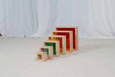 6-piece wooden rainbow stacking pyramid with graduated beech wood frames and colored translucent panels