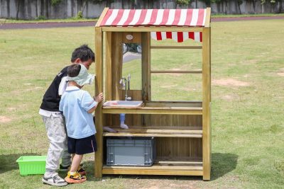 kids art storage station with integrated wash area and open shelves for preschool outdoor art