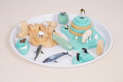 polar small world play set with a white circular tray and modular wooden frozen landscape scenery