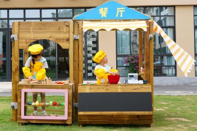 pretend restaurant playset with wooden outdoor serving counter for preschool dramatic play